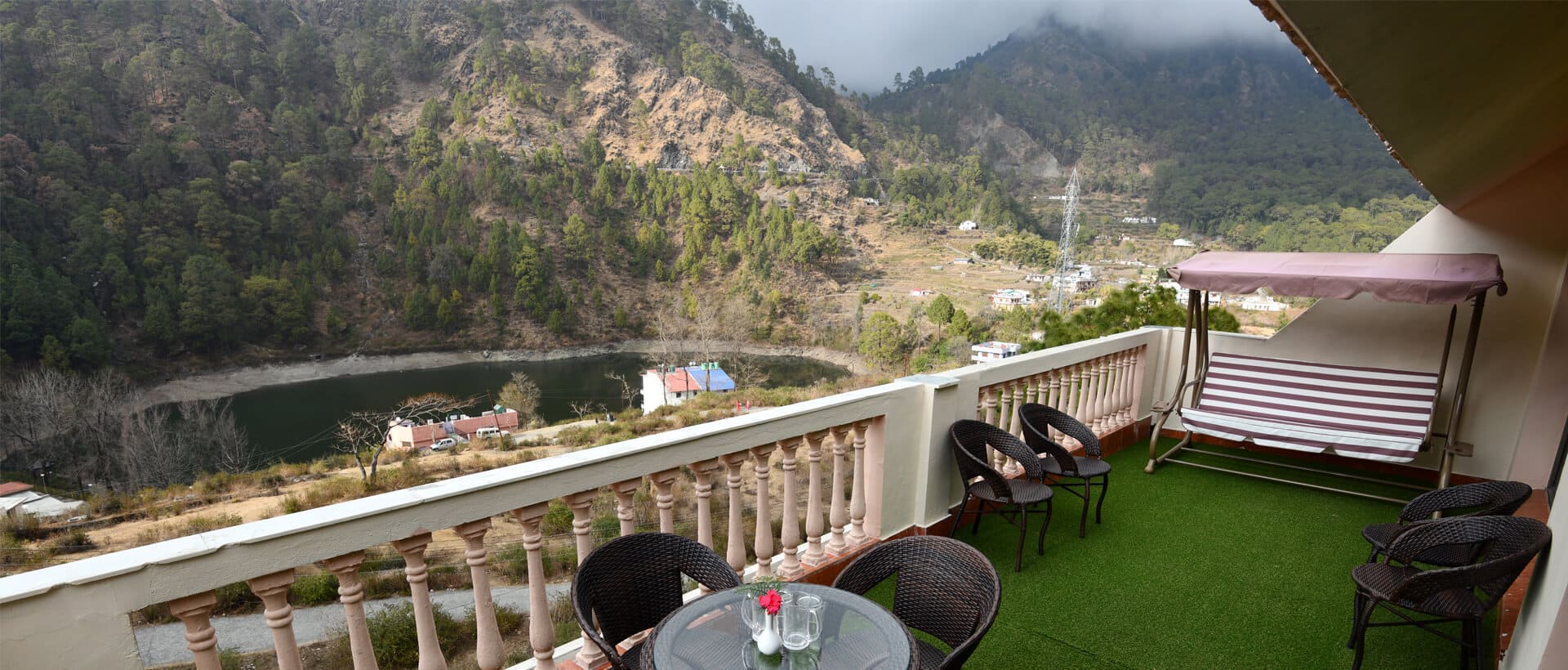 enjoy Moutains and greenery of nainital from dynasty hotel sitting area 